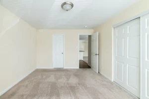 Oaks of Woodlawn bedroom with open door