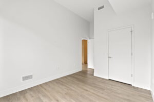 Quartermill Apartments bedroom with high ceiling