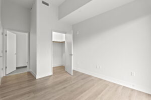 Quartermill Apartments bedroom with open closet door